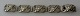 Dansk armbånd i 
sølv, o. 1930, 
med 
bladornamentik. 
L.: 20,5 cm. 
Stemplet 830 s. 
Ingen synlige 
...