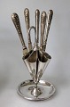 Knife holder, 
premade, in 
1900 with 5 
fruit knives in 
silver. 
Denmark. Knives 
stamped.. 830, 
...