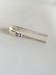 Georg Jensen 
Sterling Sølv 
Konge 
Sukkertang No 
166. Måler 10,6 
cm. Design 
Johan Rohde.