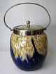Kiksespand, o. 
1900, 
flerfarvet glas 
med overfang. 