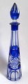 Bohemian 
crystal 
decanter, 20th 
century. With 
stopper. Clear 
crystal with 
cobolt blue 
overlay ...