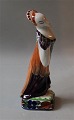 Royal 
Copenhagen 
Aluminia 
Faience 
figurine. 
670-795 Mrs. 
This & That 
(Rebekka) 18 cm 
The Evening ...