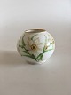 Royal 
Copenhagen Art 
Nouveau 
Overglaze vase 
with spring 
flowers. 
Measures 5,5cm 
and is in ...