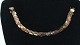 Guld Armbånd, 
18 Karat
Stempel: 750, 
21SV1
Længde 18,5 
cm.
Bredde 0,8 cm.
Flot og ...