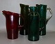 Brightly 
colored glass 
jugs.
4 different in 
green and one 
in red.