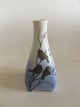 Royal 
Copenhagen Art 
nouveau Vase 
with birds No 
1724. Measures 
10,5cm and is 
in good 
condition.