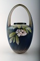 Royal 
Copenhagen Art 
Nouveau vase, 
decorated with 
flowers.
Measures 20 x 
10 cm.
Number ...