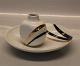 Royal 
Copenhagen
50-5328 RC 
Bowl 18 cm 
Modern 
decoration gold 
and black		kr. 
450	 $75 	£49	 
€62 ...