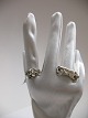Ringe i 
sterling sølv 
fra højre:
Snoet Mand 
ring Størrelse 
51, fremstillet 
af guldsmed 
John ...
