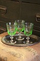 Gammelt Chr.d.8 
hvidvinsglas 
med fin grøn 
farve fra 
Holmegård 
glasværk.
H:13cm. 
Dia.:7cm. ( 15 
...