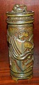 Royal Copenhagen lidded jar with figures in relief by Jais Nielsen