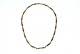 Elegant 
halskæde, 14 
Karat Guld
Stemplet: 585, 
Sv,H
Længde 42 cm. 
Bredde 4,75  
mm. ...