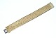 Armbånd Guld, 
18 Karat
Stemplet: 750 
AM
Længde 19 cm. 
Brede 24,5 mm
Flot og ...