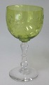 Hvidvins glas 
med lysgrøn 
kumme, 20. årh. 
Med slibninger 
på kumme. H.: 
H.: 13,2 cm. 
Antagelig ...