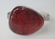 Bracelet in 
sterling silver 
with polished 
amber piece. 
20th century. 
Denmark. Amber 
with bolls. ...