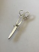 Georg Jensen 
830 Sølv 
Druesaks No 171 
med tidlige 
stempler. Måler 
15cm / 5 9/10" 
og vejer 61 ...