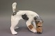 Kongelig 
porcelænsfigur, 
Ruhåret 
Foxterrier, nr. 
3020.
Mål: H: 14 cm 
B: 9,5 cm og L: 
14,5 cm.
