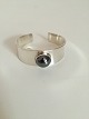 Georg Jensen 
Sterling Sølv 
Paul Hansen 
Armring No 188. 
Prydet med 
cabochonslebet 
hæmatit. Fra 
...