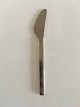 Georg Jensen 
Stainless 
Tuja/Tanaqvil 
Lunch Knife. 
Measures 18.5 m 
/ 7 9/32 in.