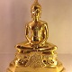 Budda 
24 karat 
førgyldt Guld 
på bronze.
Højde: 40 cm. 
Bredde: 32 cm.
Budda er 
blevet viet af 
...