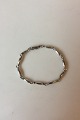 Georg Jensen 
Sterling Sølv 
Armbånd No 43. 
Fra efter 1945. 

Måler 19,5 cm. 
Vejer 13 g