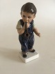 Dahl Jensen 
Figur af dreng 
med pibe No 
1027.
Måler 15,5cm.