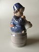 Royal 
Copenhagen 
Figurine of a 
Boy on barrel 
with a horn No. 
3689. Designed 
by Ada Bonfils. 
...