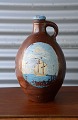 Skægmand 
vase/dunk i 
keramik fra år 
ca. 1850. 
Dunken har et 
afslag ved 
hanken og flere 
mindre ...