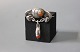 Brooch with 
amber and in 
830 silver, 
stamped Chr. J.
5,5x6 cm.
