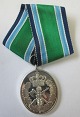 Medalje i sølv, 
for 25 års 
frivillig 
tjeneste i ...