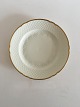 Bing & Grondahl 
Aakjaer Dinner 
Plate No 25. 
Creme with Gold 
Border. In good 
condition. 24 
cm.