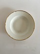 Bing & Grondahl 
Aakjaer Soup 
Plate No 23. 22 
cm. Creme with 
gold border. In 
good condition.