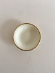 Bing & Grondahl 
Aakjaer Round 
Ashtray No 30. 
Creme with Gold 
Border. 9.5 cm. 
In good 
condition.