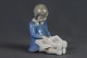 Porcelænsfigur: 
Bing og 
Grøndahl, Pige 
der læser, h: 
12 cm