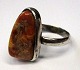 Silver ring 
with amber, 
Denmark, 20th 
century. 
Unstamped. 
Size: 61.
