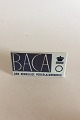 Royal 
Copenhagen 
Forhandler 
Reklame Skilt 
"Baca".
Måler 15,5cm x 
7,5cm