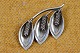 Brooch of 
silver shaped 
like small 
branch with 3 
hazel and 
catkins. 
Stamped A & K 
Sterling ...