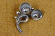 Brooch of 
silver shaped 
like a branch 
with flowers. 
Hallmark 
Sterling H.S. 
Denmark, Herman 
...
