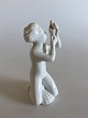 Rørstrand 
Figurine af 
Dreng med 
Konkylie. I fin 
stand. 13.5 cm 
Høj.