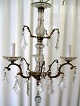 Bøhmisk 
lysekrone. 19. 
årh. Med tre 
lysearme i 
bronze. Med 
barokke 
pendler. Stamme 
i glas. H: 65 
...