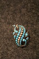 Antique silver 
brooch with 
turquoises - 
(1880) 
Measures: 
4x2,5cm.