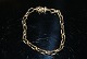Ankerkæde 
armbånd,14 
Karat Guld
Stempel: 585
Bredde 5,5  
mm.
Længde 19 cm.
Tykkelse: ...