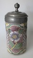 German signed 
earthenware 
beer mug, 18th 
century. With 
pewter lid.
Whitish / 
sandy glaze 
with ...