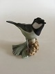 Heubach 
Figurine af 
Grøn Spurvefugl 
Kogle. Fremstår 
i pæn stand, 
men har en 
lille 
reparation på 
...