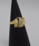 Ring i 18 karat 
guld og 
hvidguld m. 
3stk. 
brillanter á 
samlet ca. 0,20 
ct.
Ringstr. 58 
...