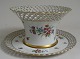 Openwork 
porcelain 
basket with 
bowl, Germany, 
20th century, 
Schirholz. 
Hand-painted 
flowers on ...