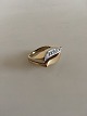 Georg Jensen 
18K Delvist 
Rhodineret 
Guldring prydet 
med ti 
brilliantslebne 
diamanter. ...