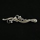 Georg Jensen 
Broche i 
Sterling Sølv 
#275
Tegnet af 
Georg Jensen 
1866 - 1935.
Stemplet med 
...