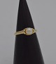 Ring i 14 karat 
guld med en 
perle á ca. 
0,55 cm. i 
diameter. 
Ringstr. 54,5 
Ø17,3
Fremstillet 
...