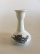 Royal 
Copenhagen 
Candlestick No 
2247/430 with 
Flower Motif. 
14 cm H (5 
33/64"). 3rd 
Quality. In ...